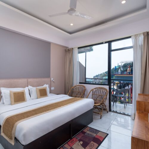 Deluxe Room with Balcony at Buddha’s Abode, McLeodGanj – Spacious stay with a private balcony and stunning Himalayan views.