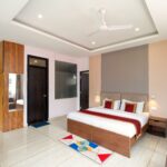 Family Room with 2 Interconnected Rooms at Buddha’s Abode, McLeodGanj – Spacious stay for families and groups with modern comforts.